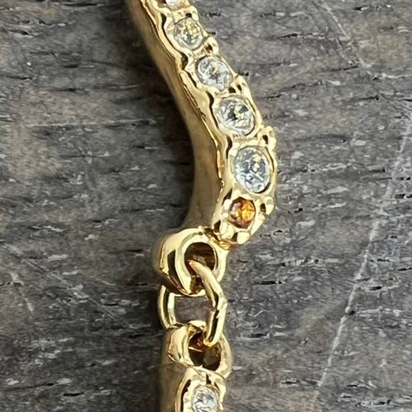 Signed Swarovski Crystal Elegant Gold Tone Wave Necklace missing one small stone - Picture 7 of 7